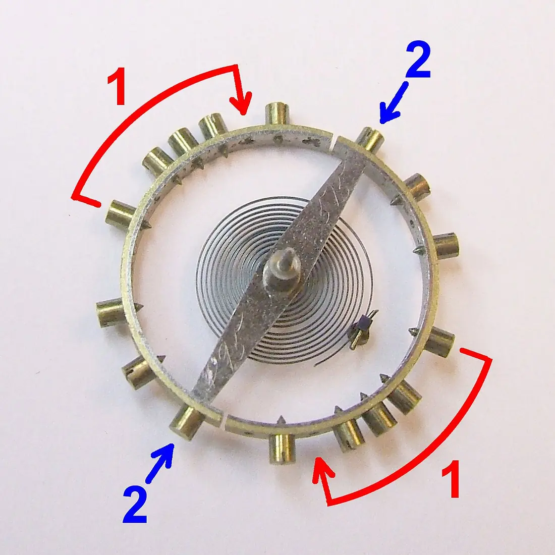 A bimetallic temperature-compensated balance wheel from an early twentieth-century pocket watch