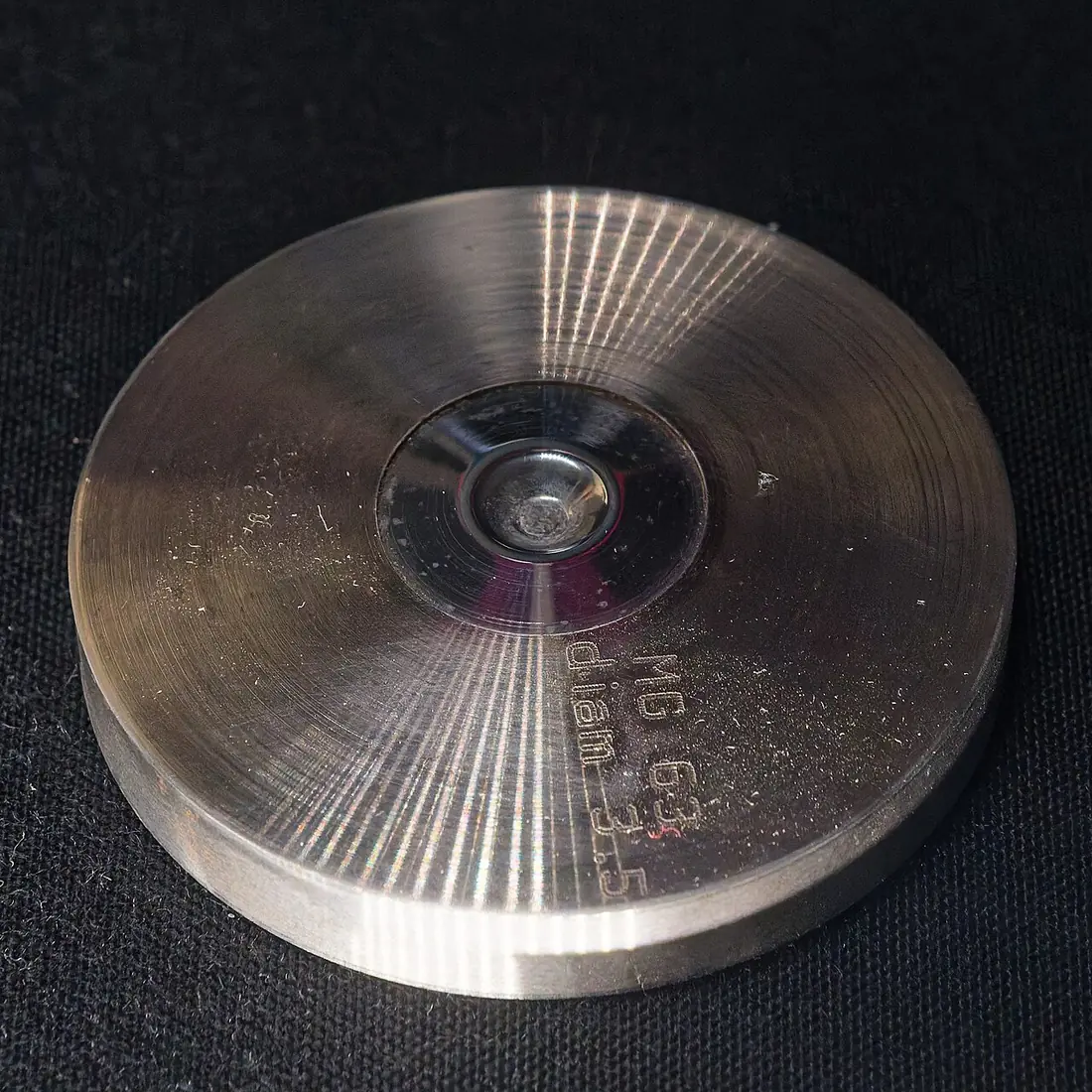 A rough diamond crystal grown by the high pressure high temperature method, displayed in a mineral collection